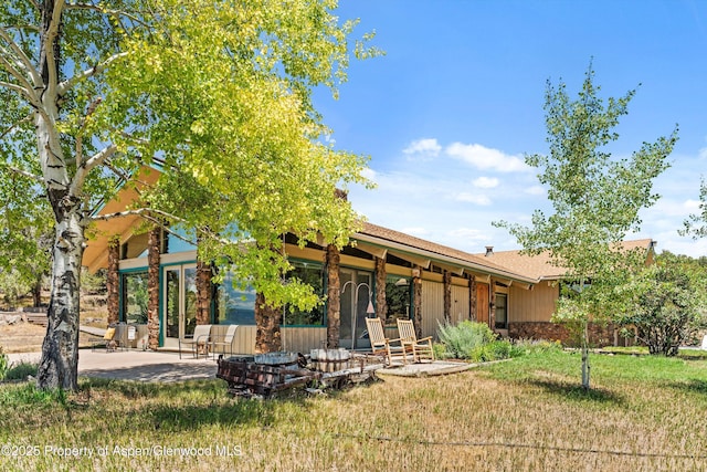 14 Fender Ln, Carbondale, CO 81623 - rear view of property featuring a patio and a yard