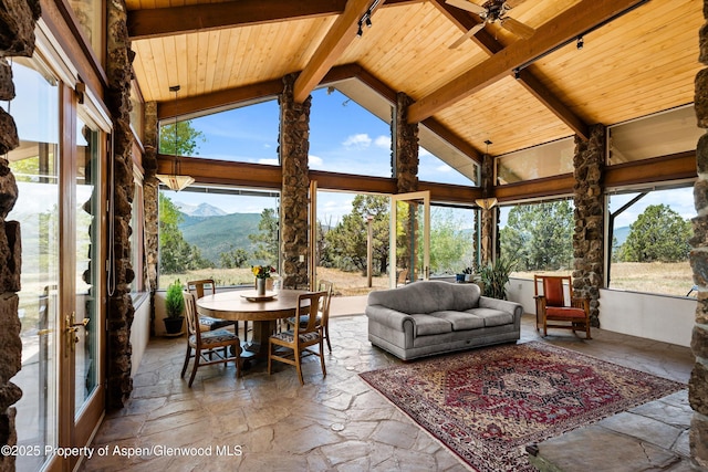 14 Fender Ln, Carbondale, CO 81623 - sunroom / solarium featuring a wood ceiling with exposed beams, a mountain view, stone tile floors, plenty of natural light, and high vaulted ceiling