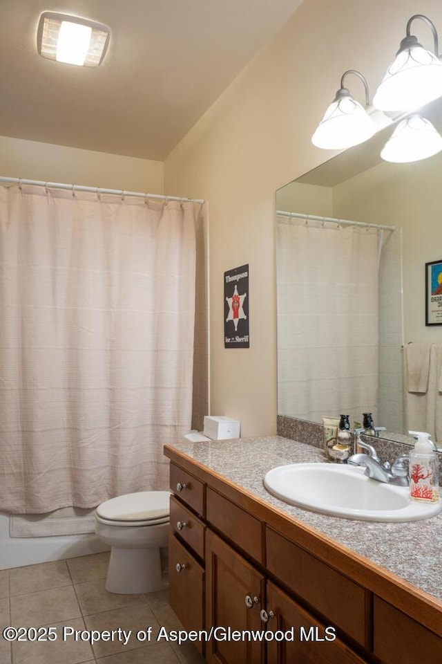 bathroom with shower / tub combo, vanity, toilet, and tile patterned floors