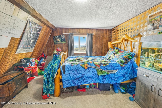 950 Highland Dr, Craig, CO 81625 - bedroom with wooden walls, carpet floors, and a textured ceiling