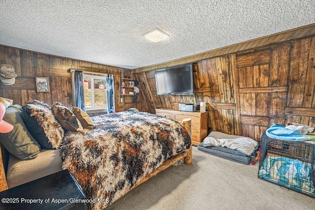 950 Highland Dr, Craig, CO 81625 - carpeted bedroom featuring wooden walls and a textured ceiling