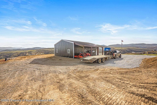 950 Highland Dr, Craig, CO 81625 - view of pole building featuring a mountain view