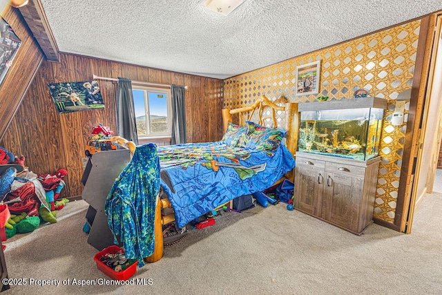 950 Highland Dr, Craig, CO 81625 - carpeted bedroom with wooden walls and a textured ceiling