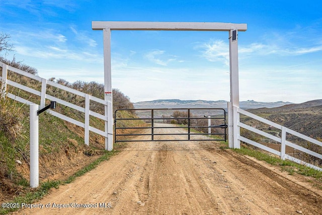 950 Highland Dr, Craig, CO 81625 - view of gate featuring fence and a mountain view