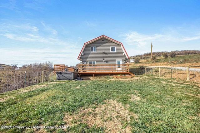 950 Highland Dr, Craig, CO 81625 - rear view of property with a yard, a gambrel roof, a fenced backyard, and a wooden deck
