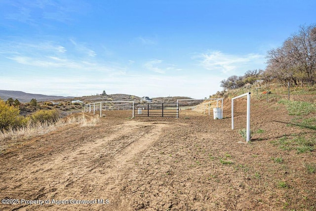 950 Highland Dr, Craig, CO 81625 - view of yard featuring fence, a rural view, and a gate