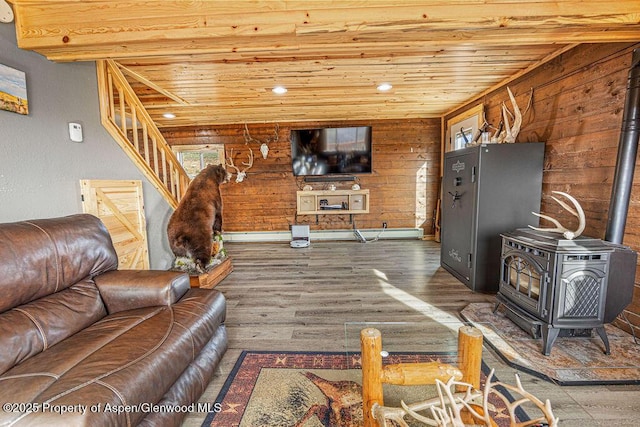 950 Highland Dr, Craig, CO 81625 - living room featuring wooden ceiling, wood finished floors, stairway, baseboards, and a wood stove