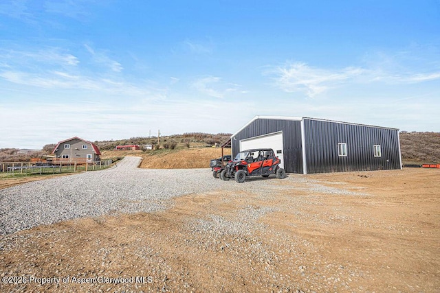 950 Highland Dr, Craig, CO 81625 - exterior space featuring an outdoor structure and gravel driveway