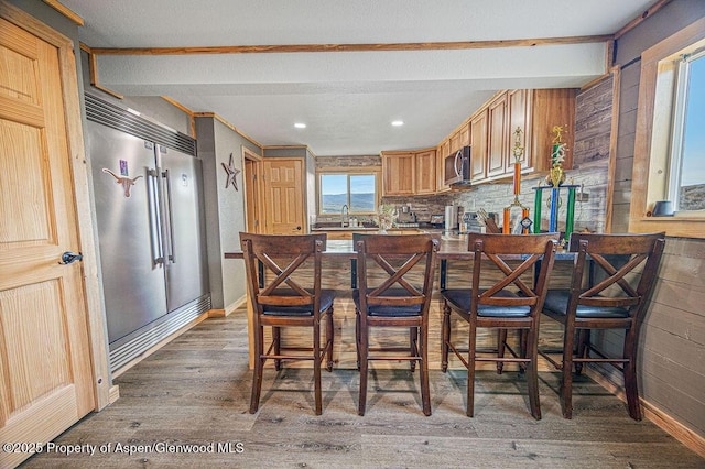 950 Highland Dr, Craig, CO 81625 - kitchen with baseboards, stainless steel appliances, wood finished floors, and a sink