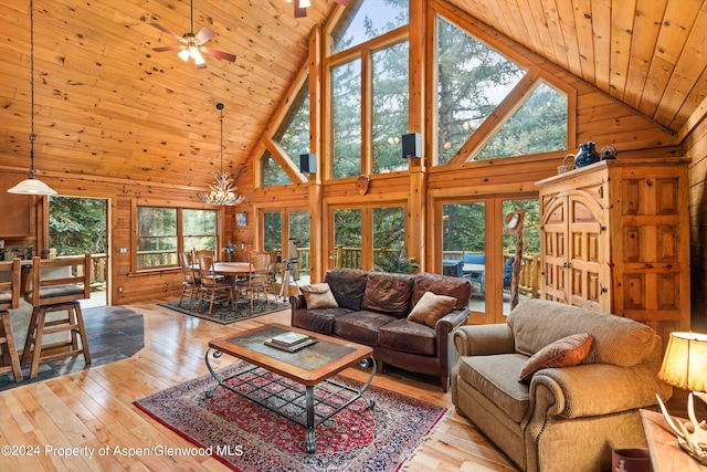 living room featuring french doors, high vaulted ceiling, wood ceiling, ceiling fan with notable chandelier, and light wood-type flooring