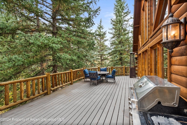 wooden deck featuring grilling area