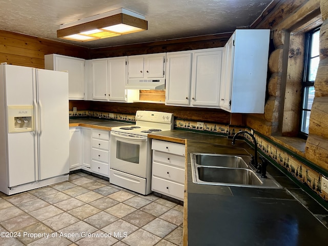 kitchen with white cabinetry, white appliances, sink, and light tile patterned floors