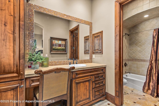 full bathroom featuring vanity, toilet, and shower / tub combo