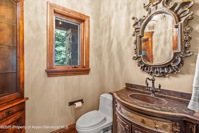 bathroom with vanity and toilet
