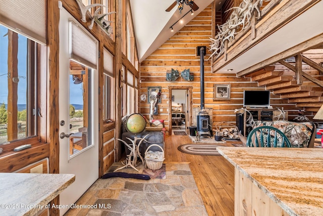 76 County Road 60b, Maybell, CO 81640 - interior space featuring a high ceiling, hardwood / wood-style floors, and a wood stove