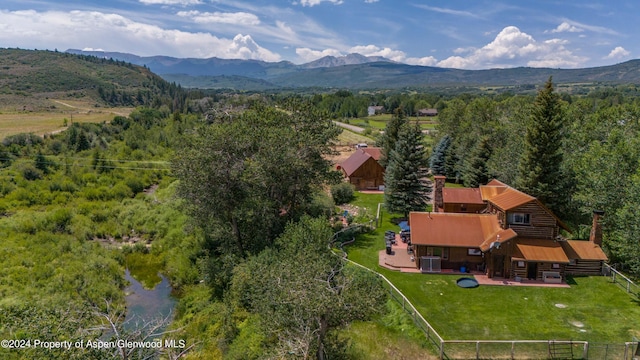 birds eye view of property with a mountain view