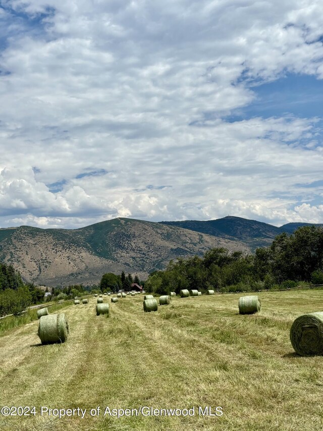 mountain view featuring a rural view