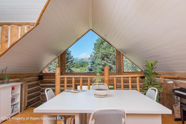 1150 Capitol Creek Rd, Snowmass, CO 81654 - dining space with rustic walls, vaulted ceiling, wood finished floors, wood ceiling, and a mountain view