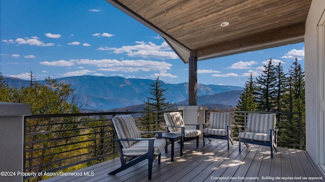 wooden terrace with a mountain view