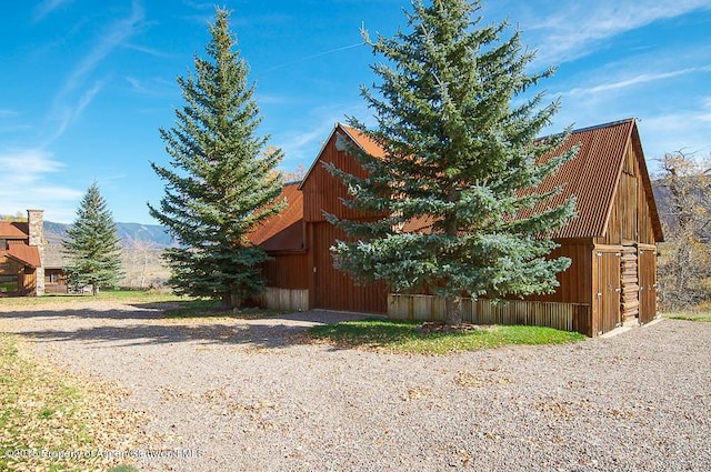 1150 Capitol Creek Rd, Snowmass, CO 81654 - view of home's exterior with an outdoor structure and a barn