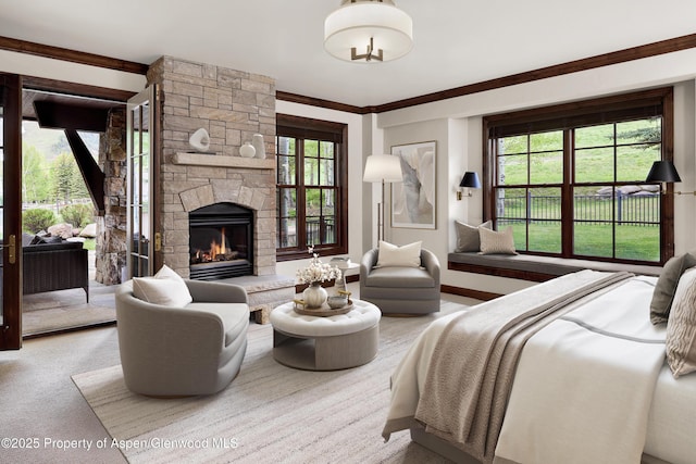 611 Oregon Trl, Aspen, CO 81611 - carpeted bedroom with a stone fireplace and access to outside