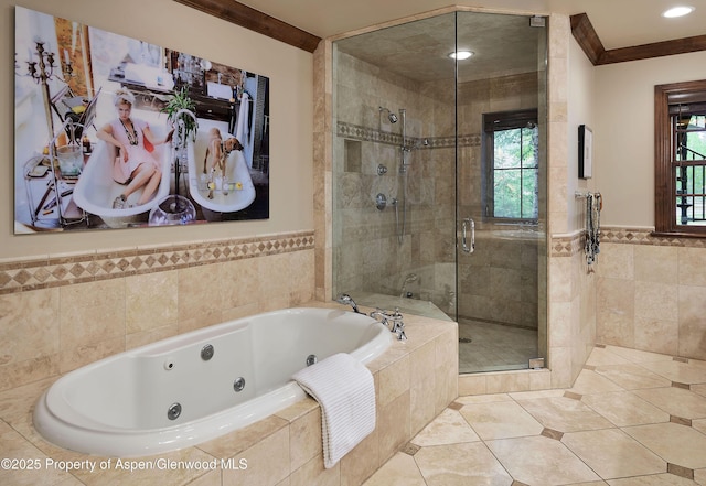 611 Oregon Trl, Aspen, CO 81611 - bathroom featuring a shower stall, tile walls, a jetted tub, tile patterned flooring, and ornamental molding