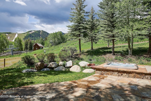 611 Oregon Trl, Aspen, CO 81611 - view of yard featuring a view of rural / pastoral area, a mountain view, and an outdoor hot tub