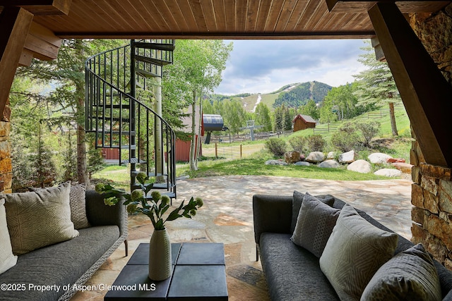 611 Oregon Trl, Aspen, CO 81611 - view of patio / terrace with stairs, a mountain view, and an outdoor living space