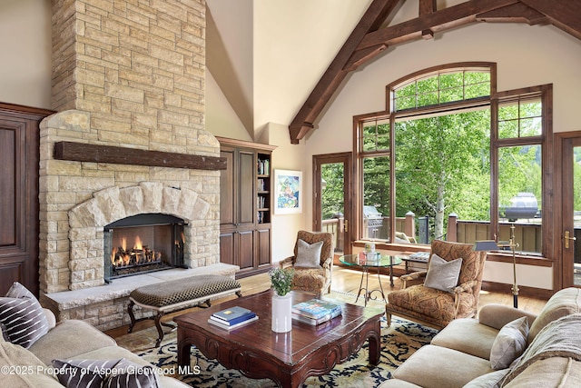 611 Oregon Trl, Aspen, CO 81611 - living area featuring high vaulted ceiling, a fireplace, and wood finished floors