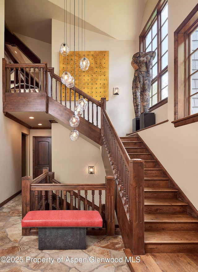 611 Oregon Trl, Aspen, CO 81611 - stairs featuring a high ceiling and stone tile flooring