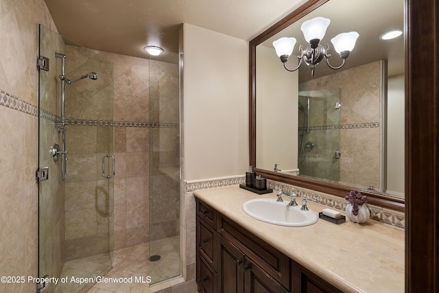 611 Oregon Trl, Aspen, CO 81611 - full bathroom with vanity, a stall shower, and a chandelier