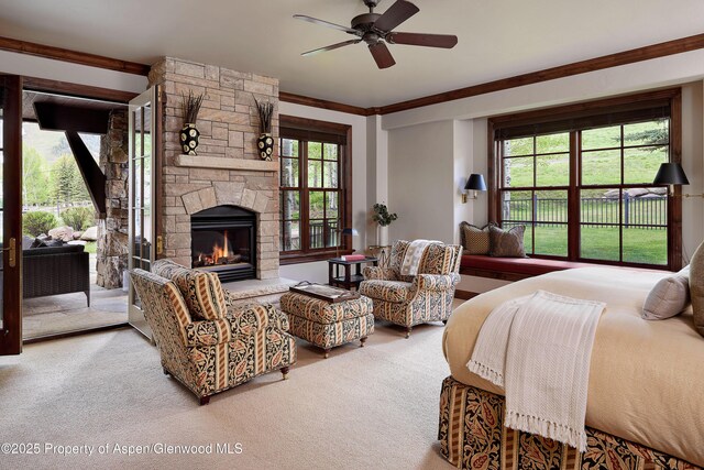 611 Oregon Trl, Aspen, CO 81611 - bedroom featuring access to exterior, a fireplace, carpet flooring, and ornamental molding