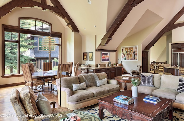 611 Oregon Trl, Aspen, CO 81611 - living room with light wood-style floors, beam ceiling, and high vaulted ceiling