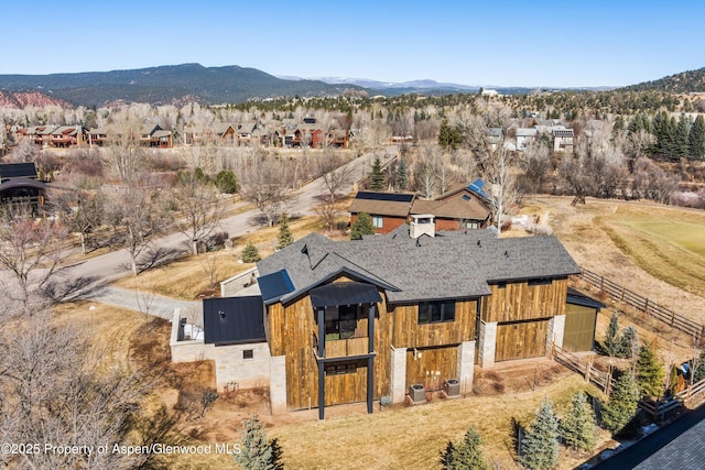 birds eye view of property featuring a mountain view