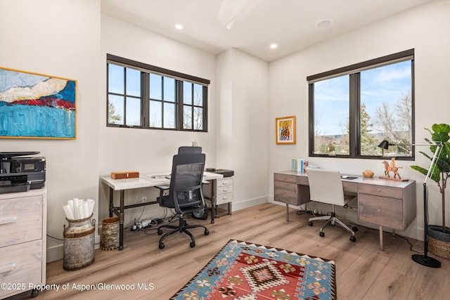 home office featuring baseboards, plenty of natural light, wood finished floors, and recessed lighting