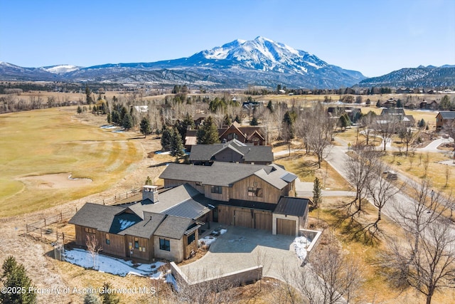 birds eye view of property featuring a mountain view