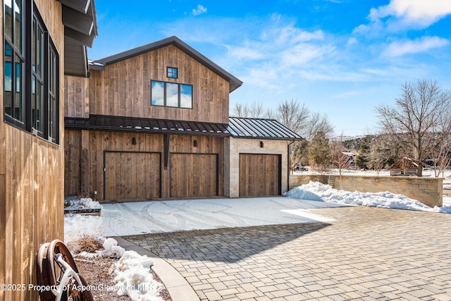 view of snow covered garage