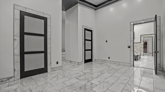 foyer entrance with a high ceiling