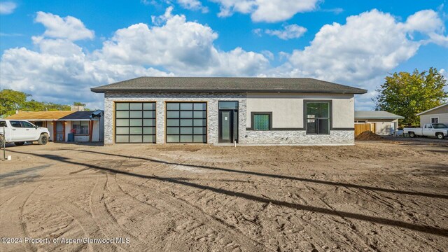 view of front of property with a garage