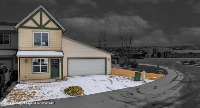 view of front of home with a garage