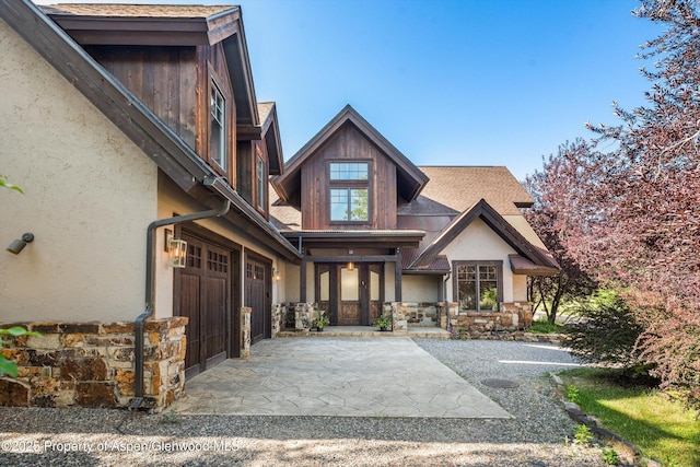 11 Pinon Ln, Carbondale, CO 81623 - view of front of house featuring stone siding, stucco siding, and an attached garage