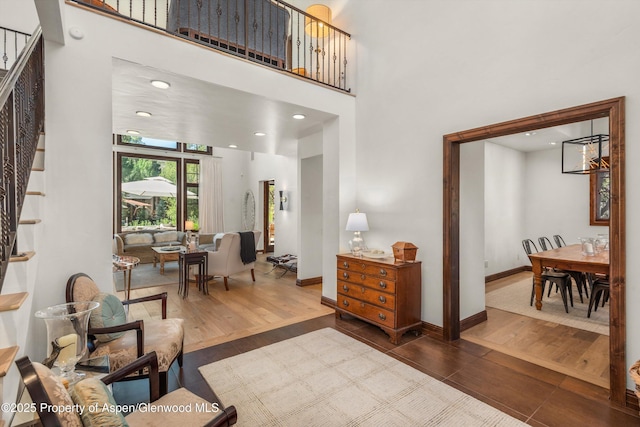 11 Pinon Ln, Carbondale, CO 81623 - living area with stairway, wood finished floors, and a high ceiling