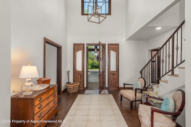 11 Pinon Ln, Carbondale, CO 81623 - entryway featuring a towering ceiling, stairs, and a chandelier