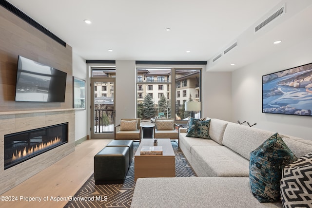 living room featuring a fireplace and hardwood / wood-style floors