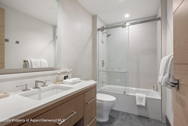 full bathroom featuring vanity, toilet, and enclosed tub / shower combo