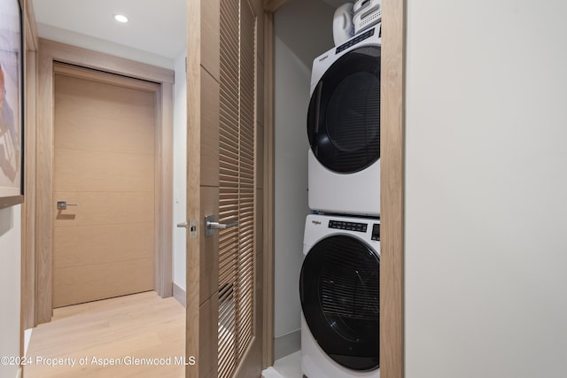 130 Wood Road 256 & 258, Snowmass Village, CO 81615 - laundry area with light hardwood / wood-style floors and stacked washer / dryer