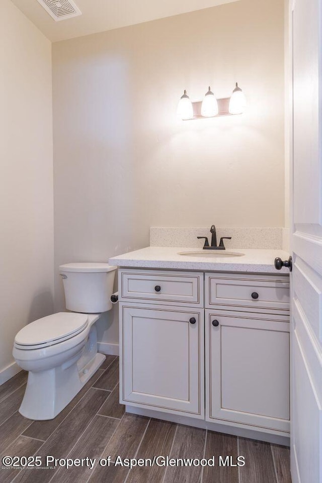 682 Eagles Nest Dr, Silt, CO 81652 - half bath with vanity and wood finished floors