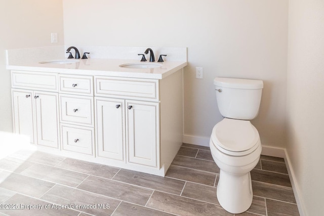 682 Eagles Nest Dr, Silt, CO 81652 - bathroom featuring wood tiled floors and double vanity