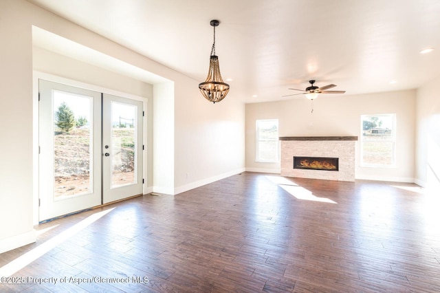 682 Eagles Nest Dr, Silt, CO 81652 - unfurnished living room with plenty of natural light, wood finished floors, a ceiling fan, a chandelier, and recessed lighting