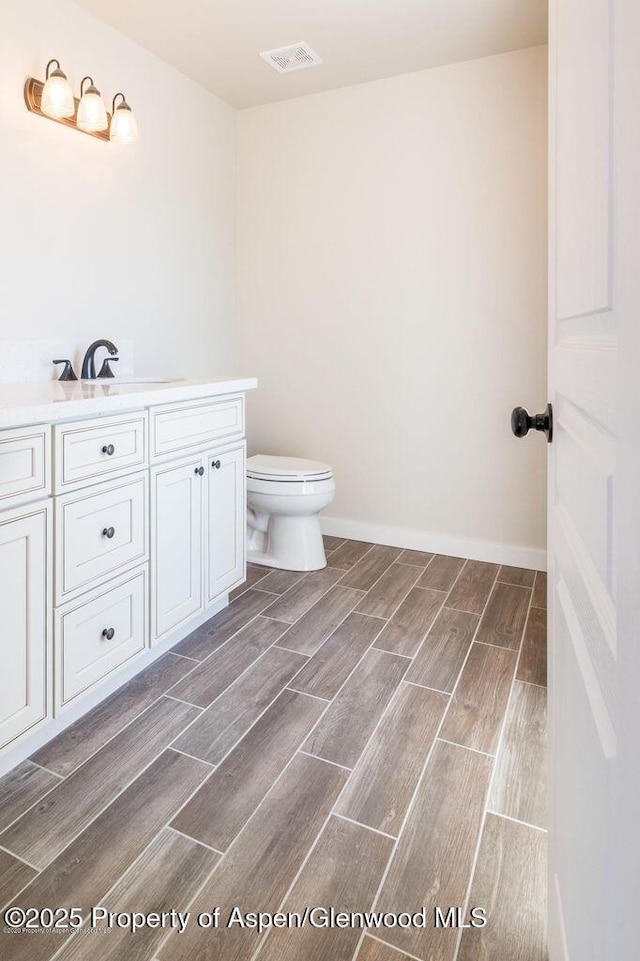 682 Eagles Nest Dr, Silt, CO 81652 - bathroom featuring wood finish floors and vanity